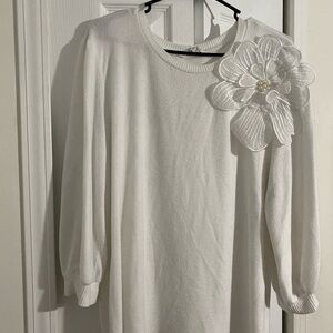 Elegant White Sweater with Floral Accent